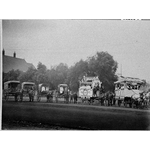 062235PD: Horse drawn delivery carts and parade floats in Boulder ca.1910
