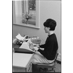 319468PD: Trudy Walherden transcribing an oral history at the Battye Library, 1966
