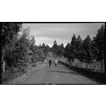 112057PD: Walking along a Kalamunda road, 1920s