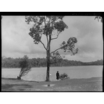 017052PD: Woman looking at dam, 1939