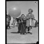 046983PD: Tom Jewell and his sister Joan at the show, 1949