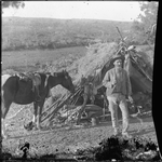 030148PD: A prospector and his horse in camp, ca. 1905