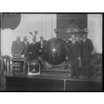101697PD: Men on stage with competition barrel, 1932?