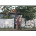 146409PD: Mick and Mona Braddock at the front gate of their home, 18 Hainault Road, Boulder, 1991-1992