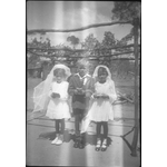 BA2666/90: L-R: Lois Phillips, Kevin Walley and Norma Walley dressed for their first Holy Communion, Goomalling, ca.1956