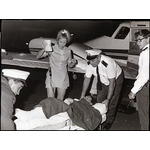 BA2749/2134: Robin Miller unloading a patient from a Royal Flying Doctor Service Duke aircraft at Port Hedland, 1969