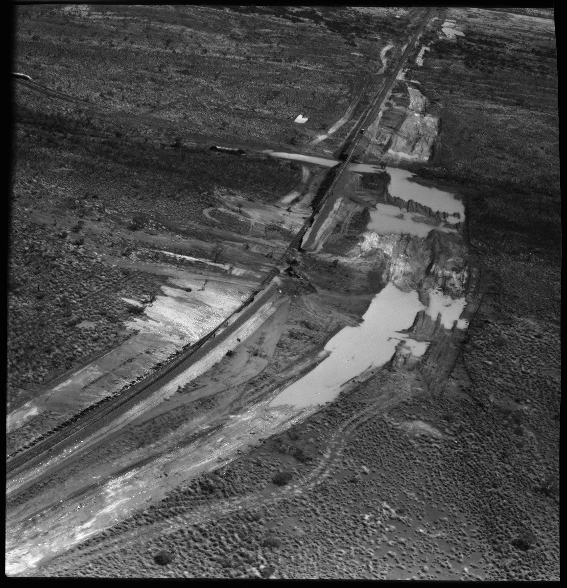 Aerial photographs of damage caused to the construction of Iron mining facilities at King Bay