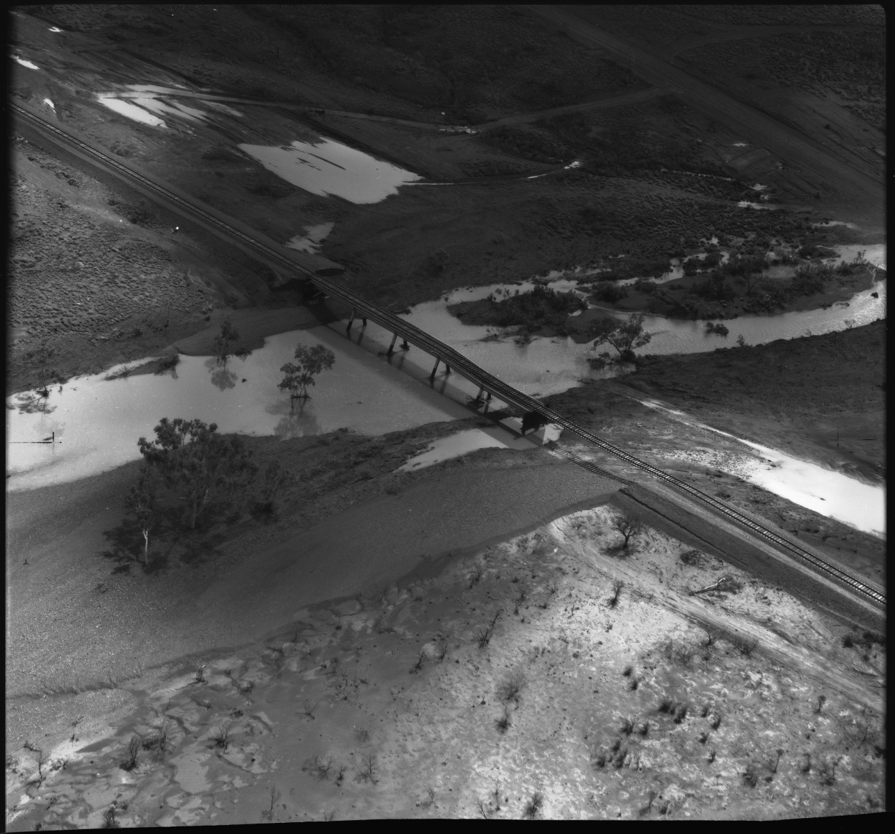 Aerial photographs of damage caused to the construction of Iron mining facilities at King Bay