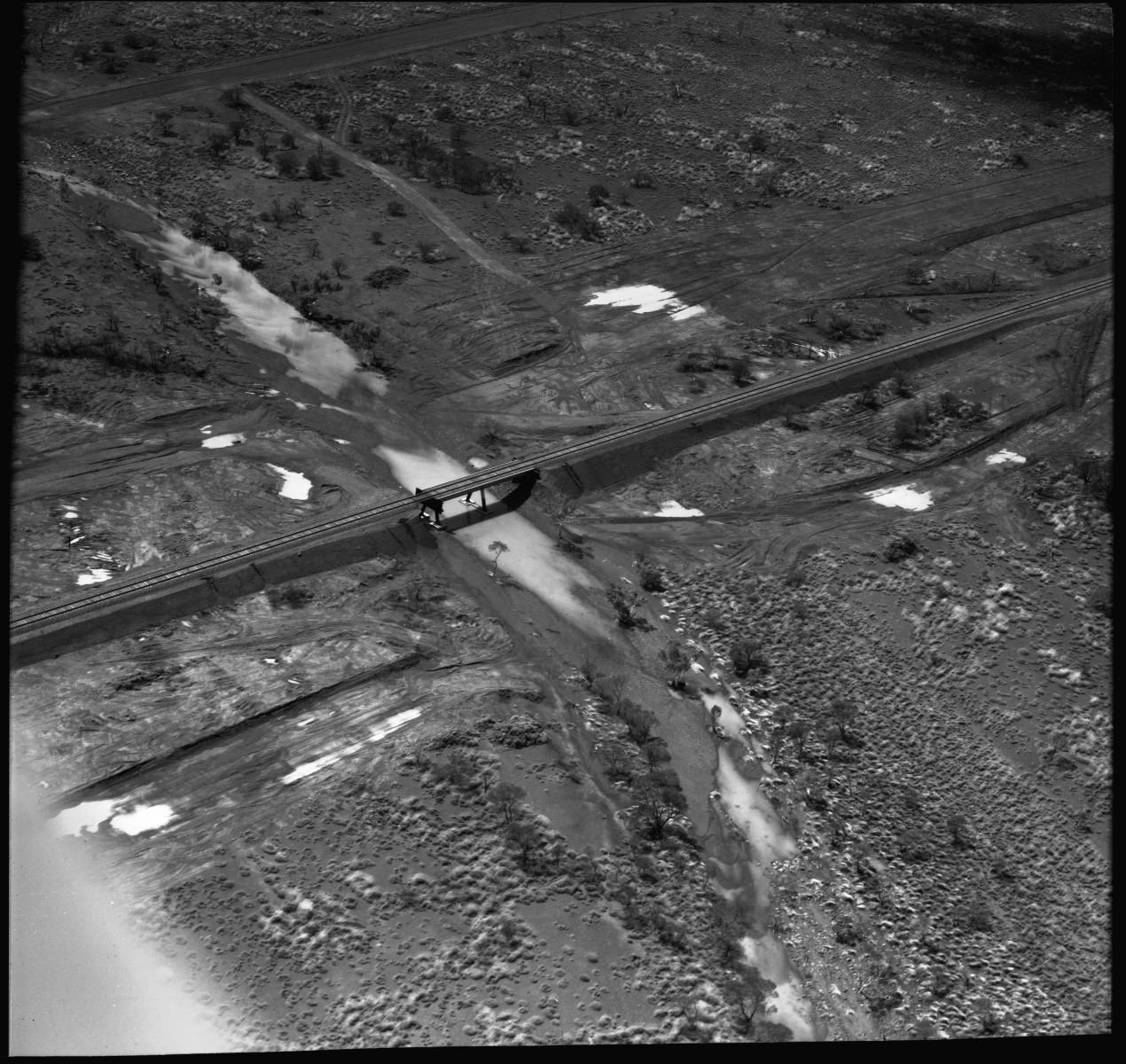 Aerial photographs of damage caused to the construction of Iron mining facilities at King Bay