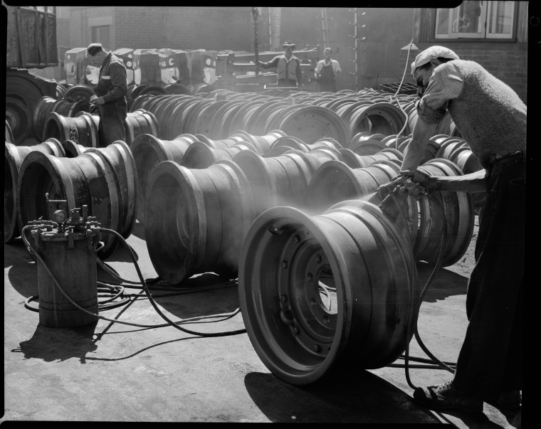 Spray painting a Chamberlain Countryman tractor and tractor parts