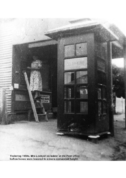 YP20: Mrs Lockyer on ladder at the Post Office before boxes were lowered to a more convenient height, 1950s