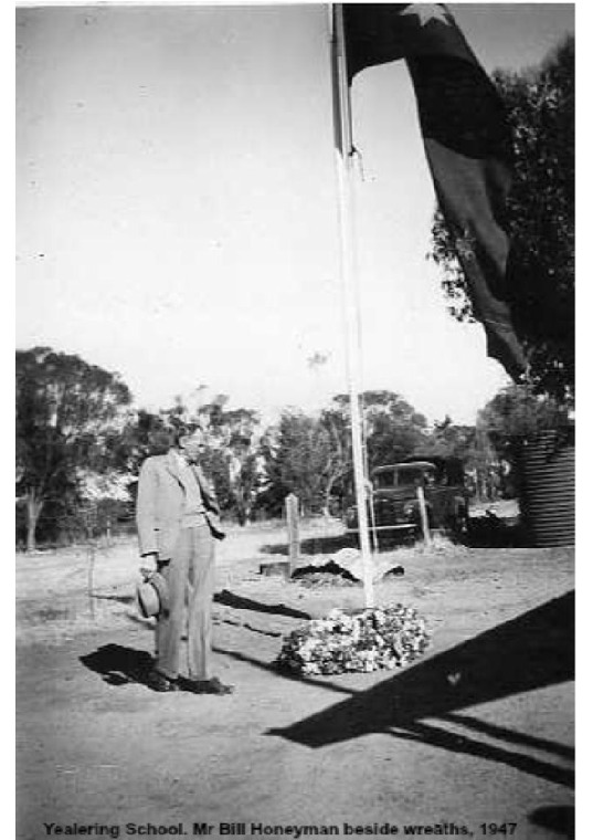 YS8: Yealering school. Mr Bill Honeyman beside wreath, 1947