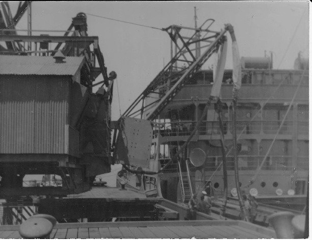 BA2606/10: Ship being loaded with iron ore at jetty, Cockatoo Island