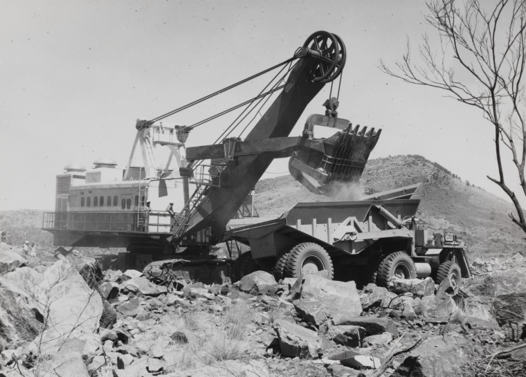 A Marion power shovel and KW Dart truck working on 'the big cut ...