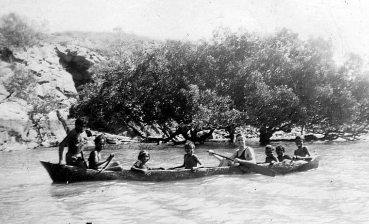 Bardi people and Preston Walker in a dugout canoe on Sunday Island ...