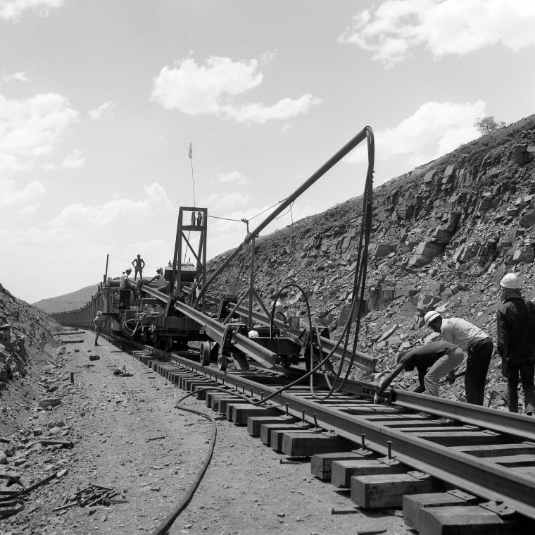Track laying on the DampierTom Price Railway in the Chichester Range. State Library of