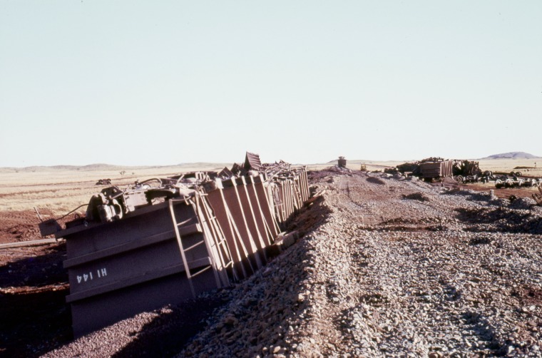 A train derailment on the DampierTom Price Railway after heavy rains. State Library of