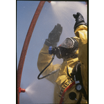Western Power worker in a hazmat in washdown during an emergency ...