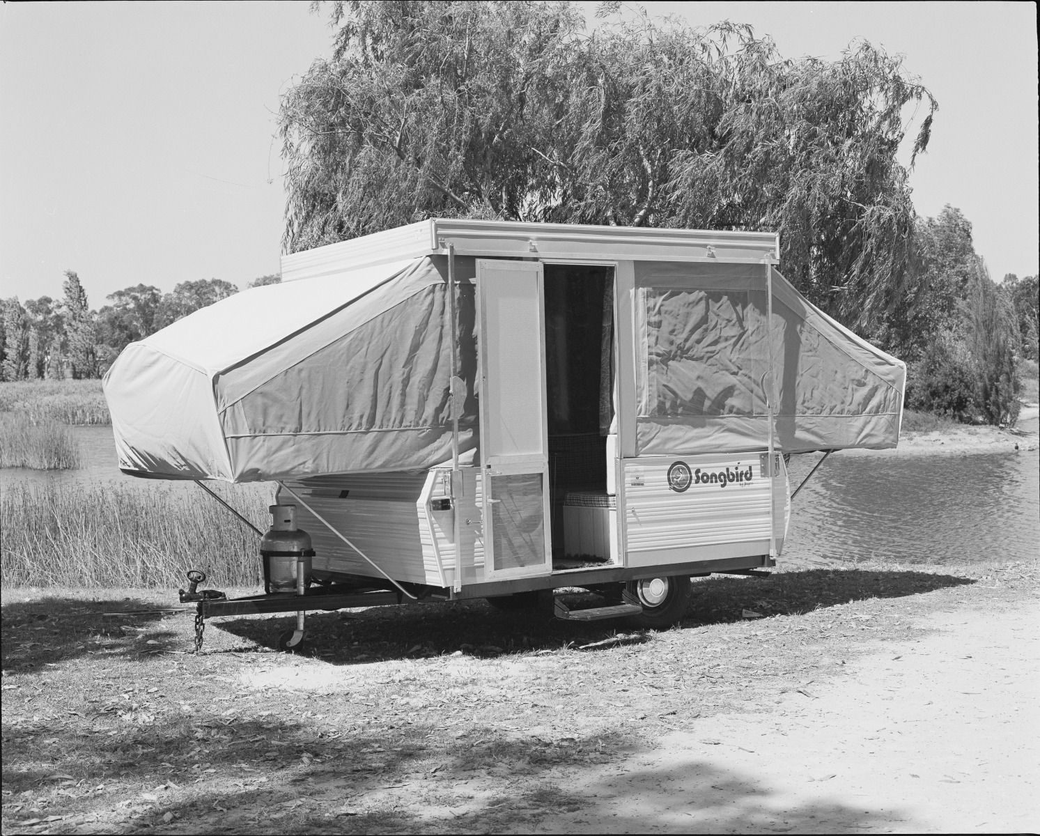 Setting up a Songbird popup camper trailer made by Jayco, Perth, 26 November 1979. State