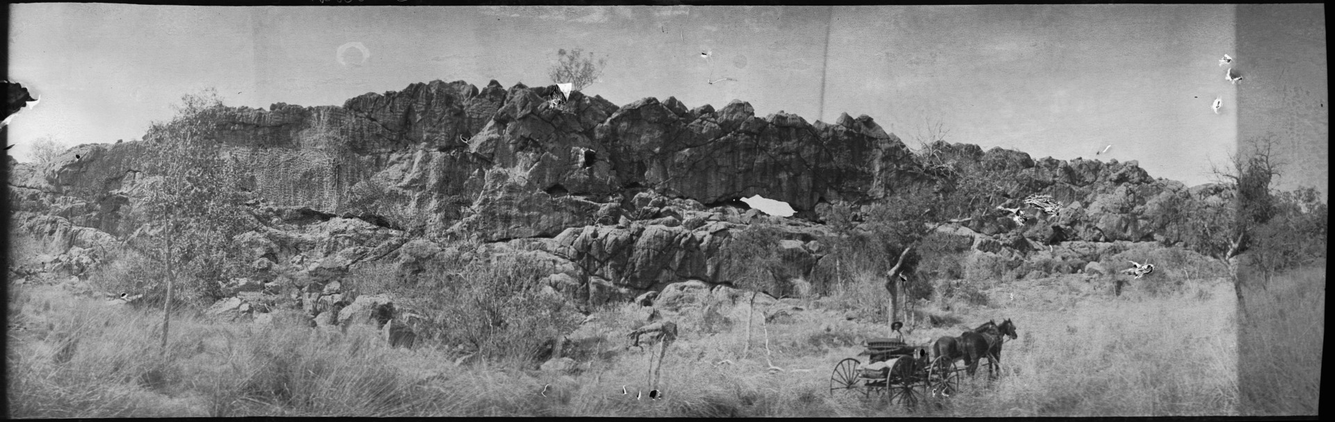 Horse and buggy by a limestone rock formation, 7 miles from Rosewood ...