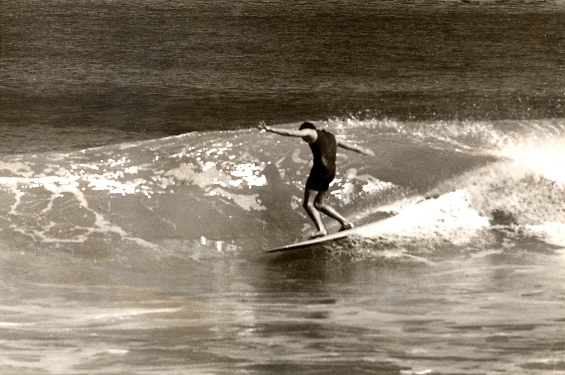Brian Hood surfing at Scarborough Beach. State Library of Western